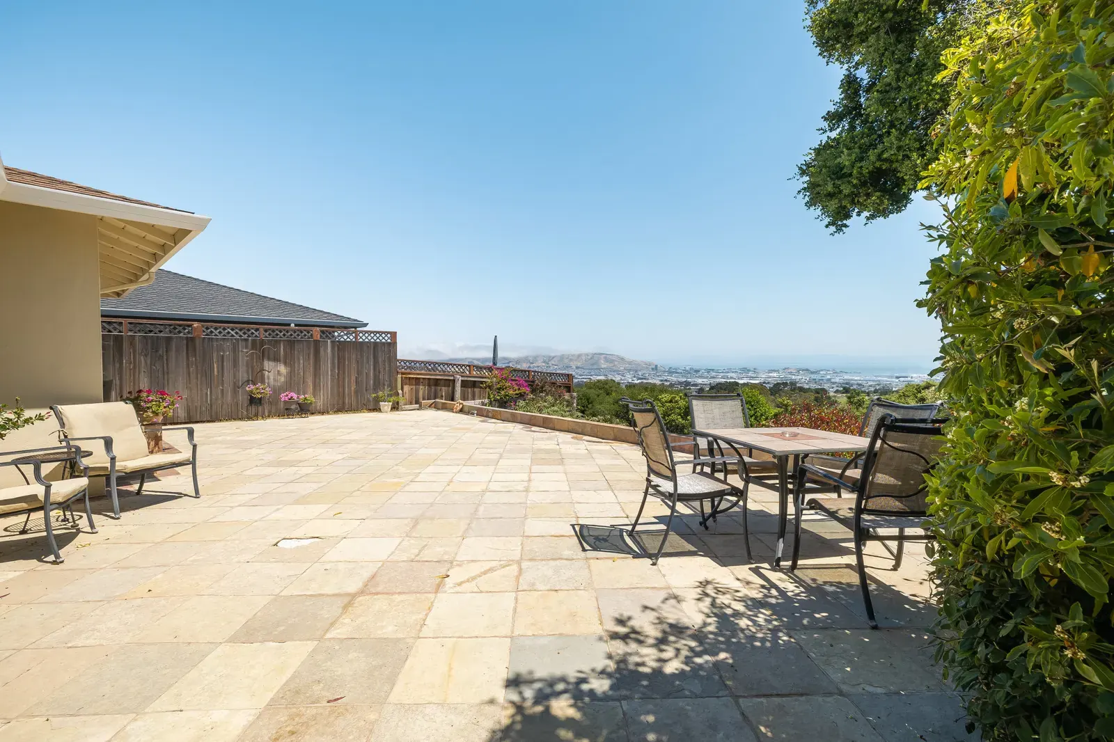 Backyard patio with a bay view at 3341 Crestmoor Drive, a San Bruno home in the Crestmoor hills