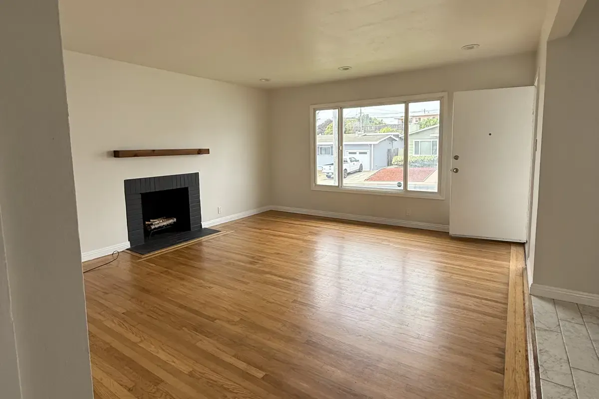 Living room of 328 Heather Way, a South San Francisco Peninsula home, before staging
